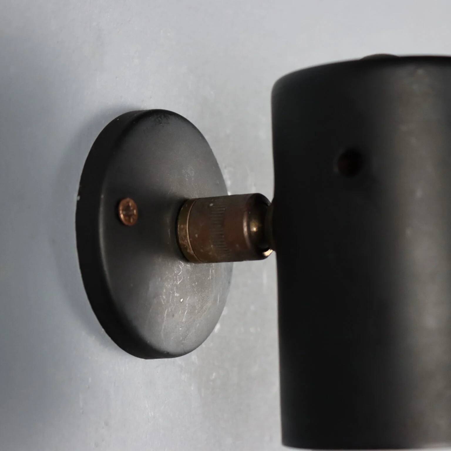 Adjustable black metal wall sconces from the 1960s.