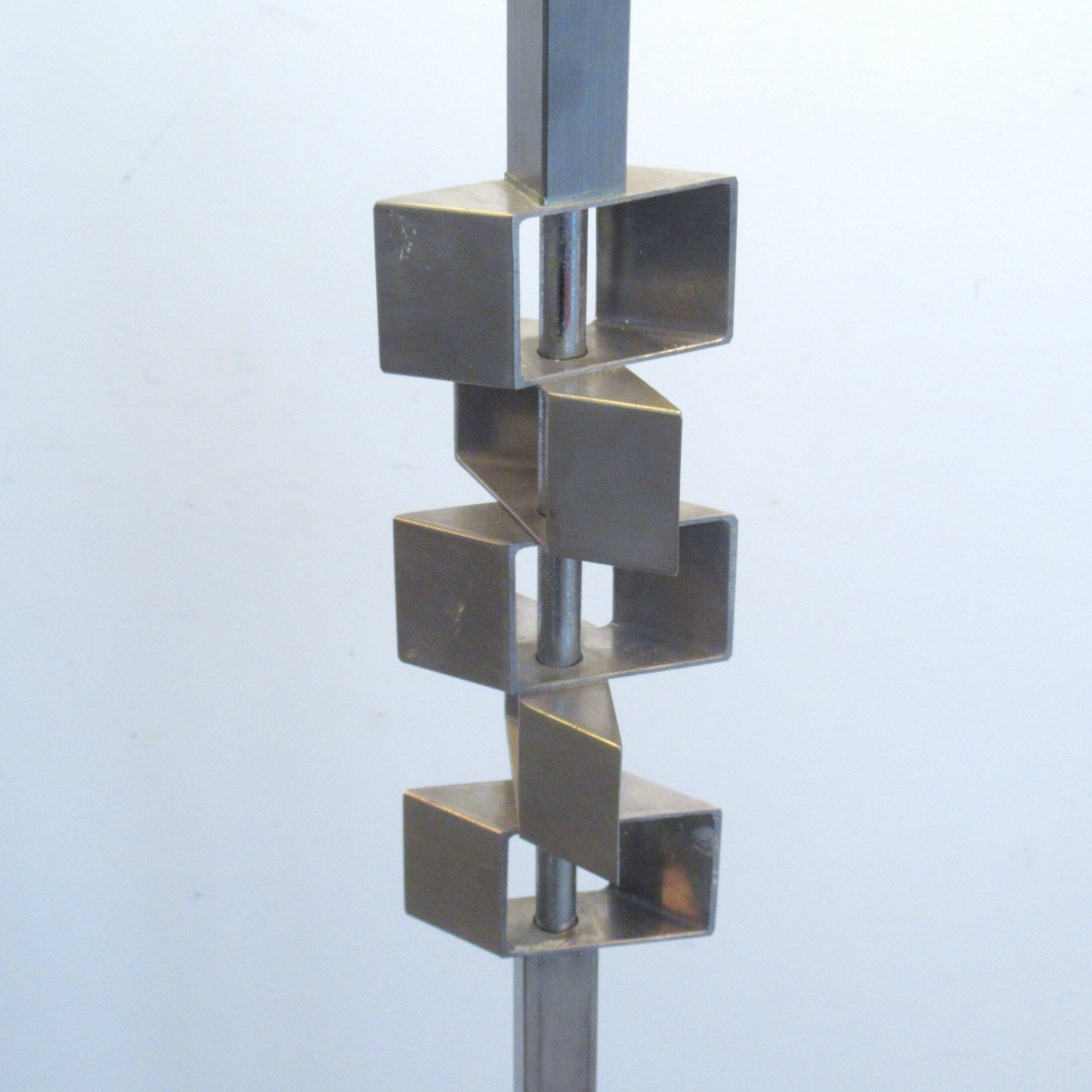 Floor lamp with a large orange shade and metal from the 1960s.
