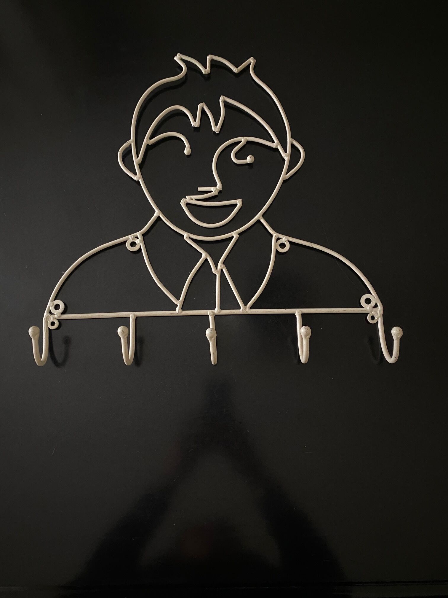 Pair of iron coat holders girl and boy