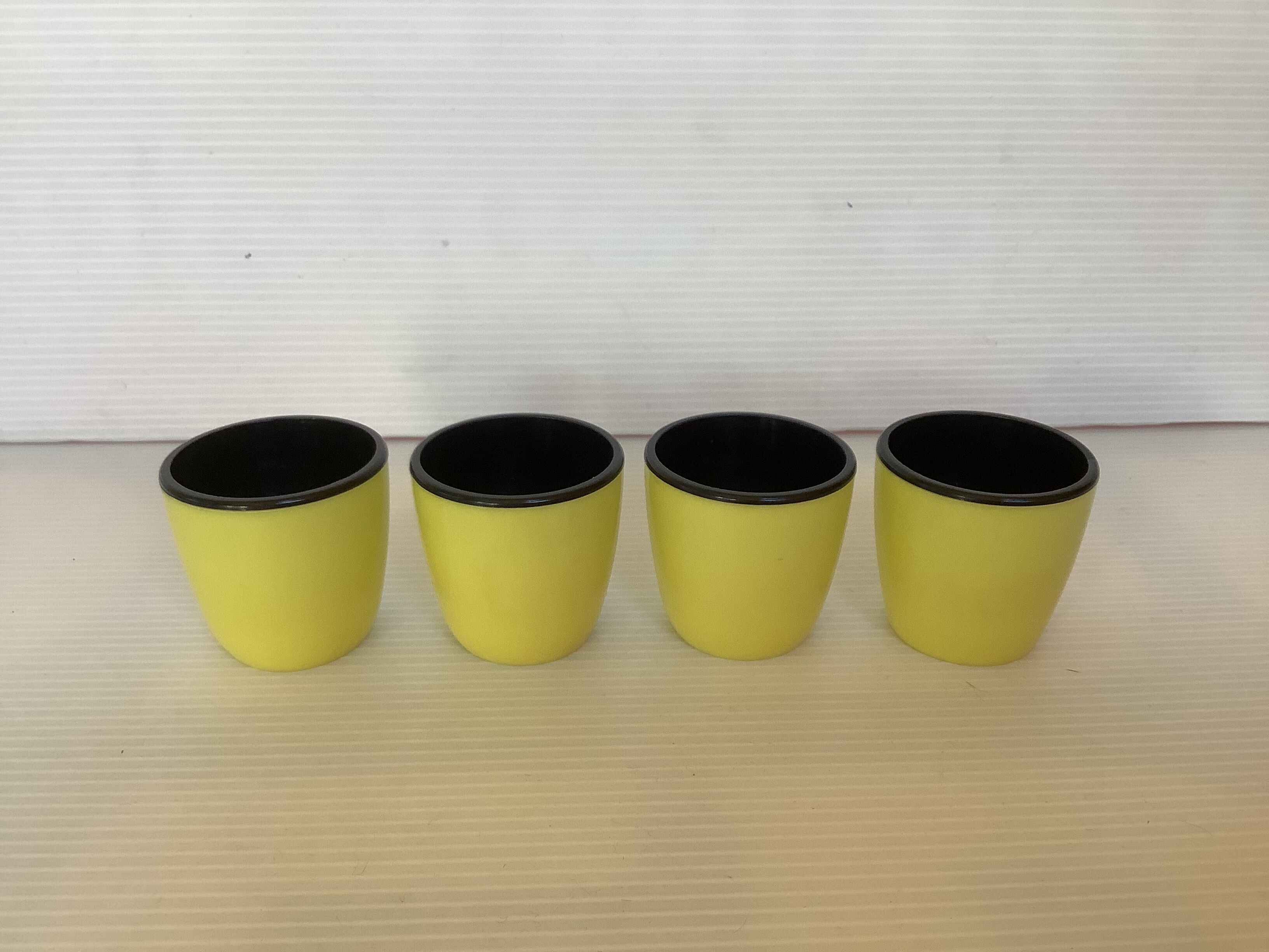 4 old eggcups yellow and black Emsa