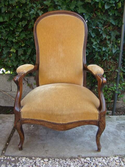 Old walnut Voltaire armchair