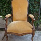 Old walnut Voltaire armchair