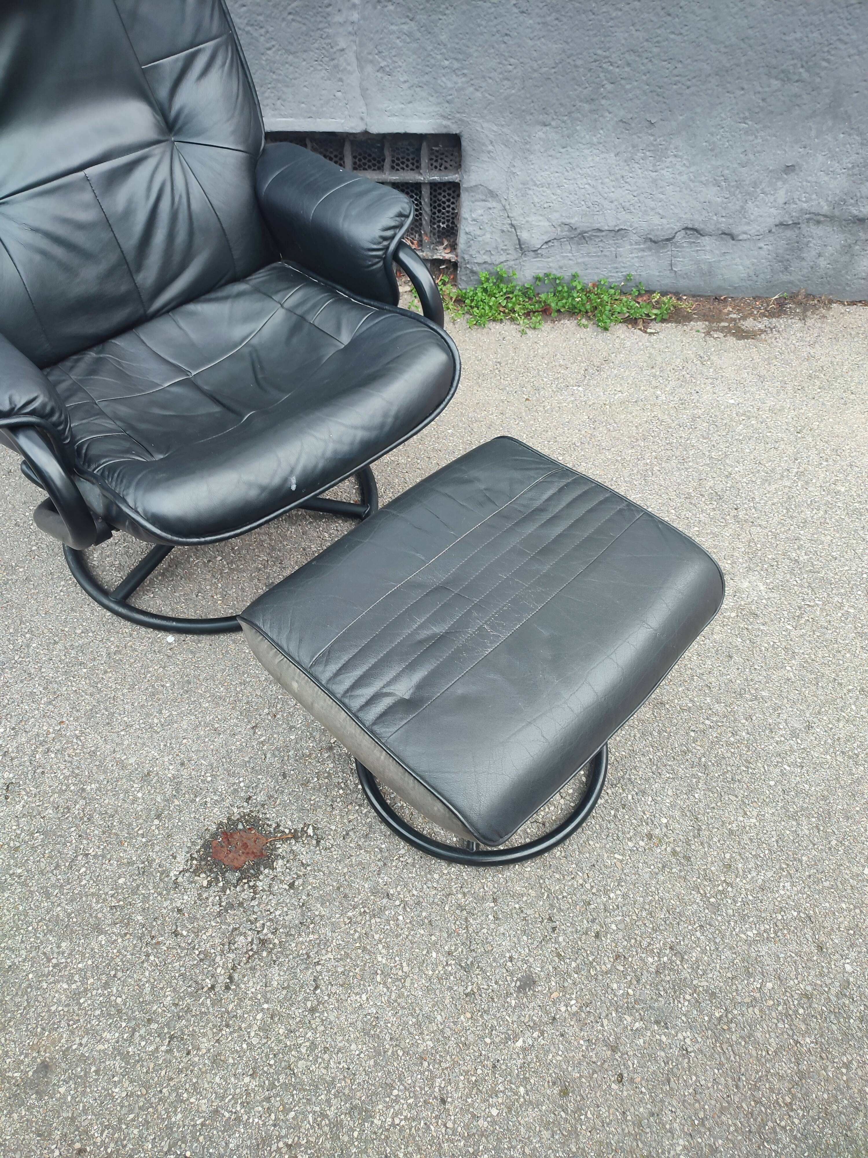 Scandinavian design leather armchair and footrest