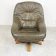 Brutalist oak and leather swivel chair, 1970s