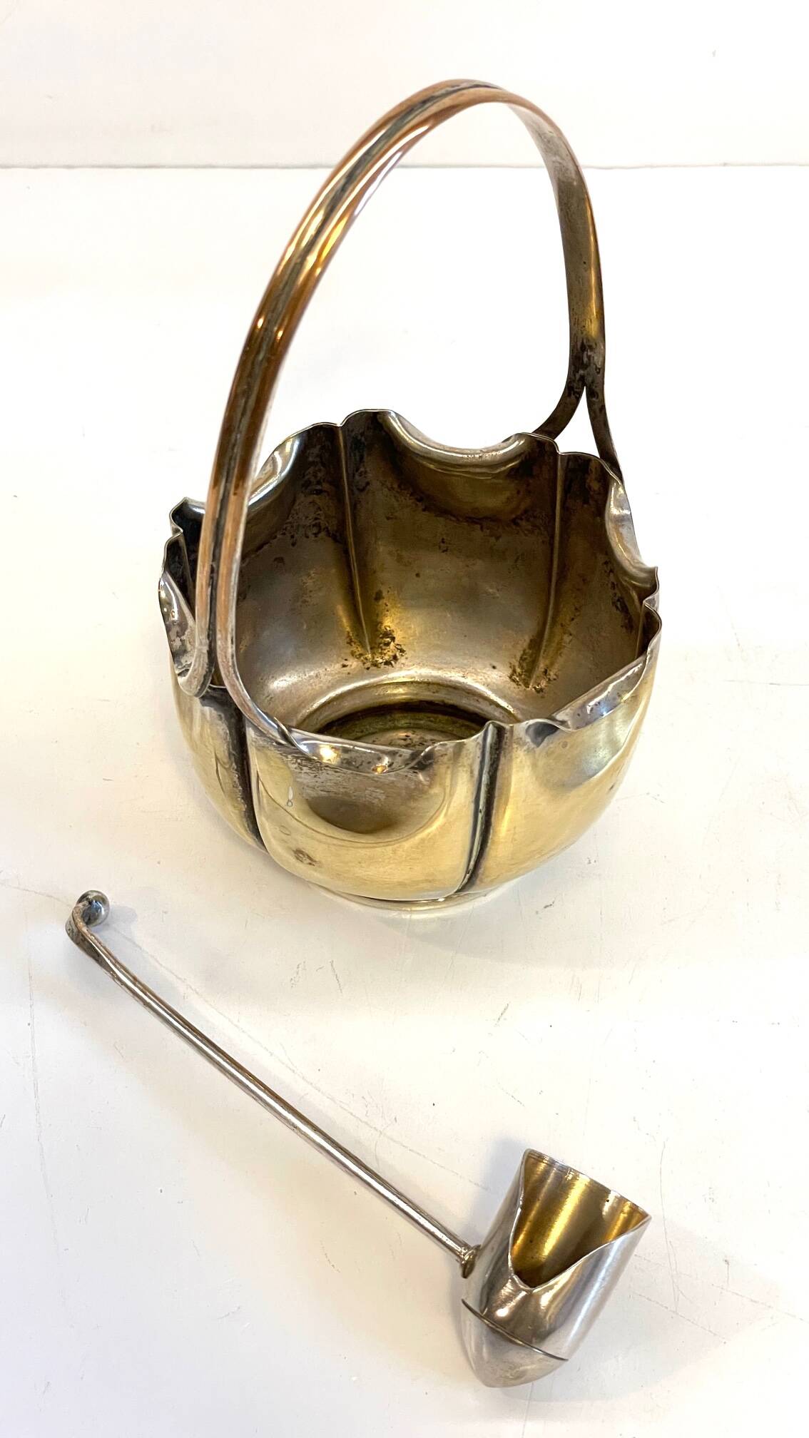 silver metal sugar bowl with gold patina