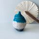 Poterie en terre cuite émaillée bleu et crème