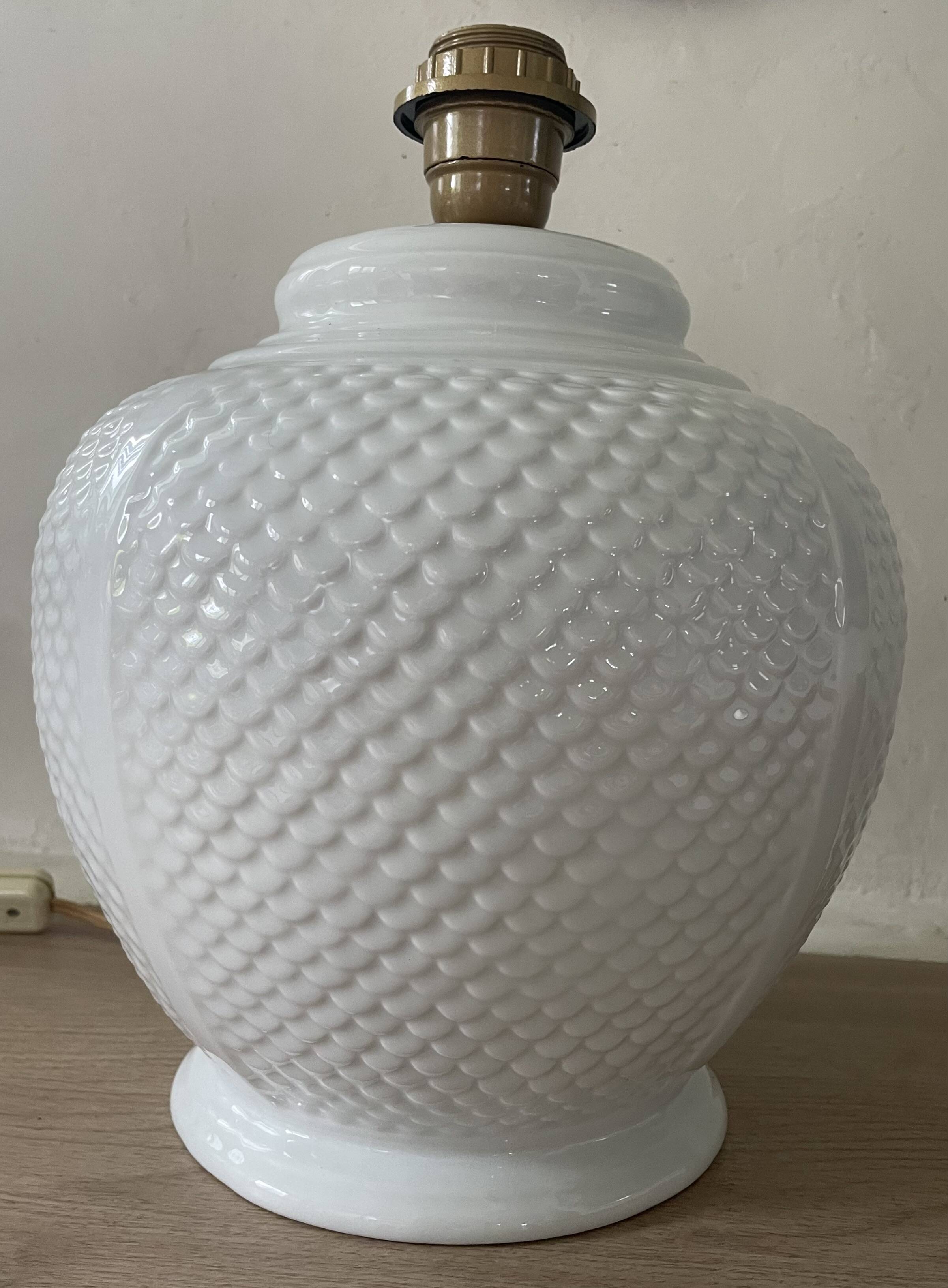 Vintage ceramic lamp with glazed scale patterns.