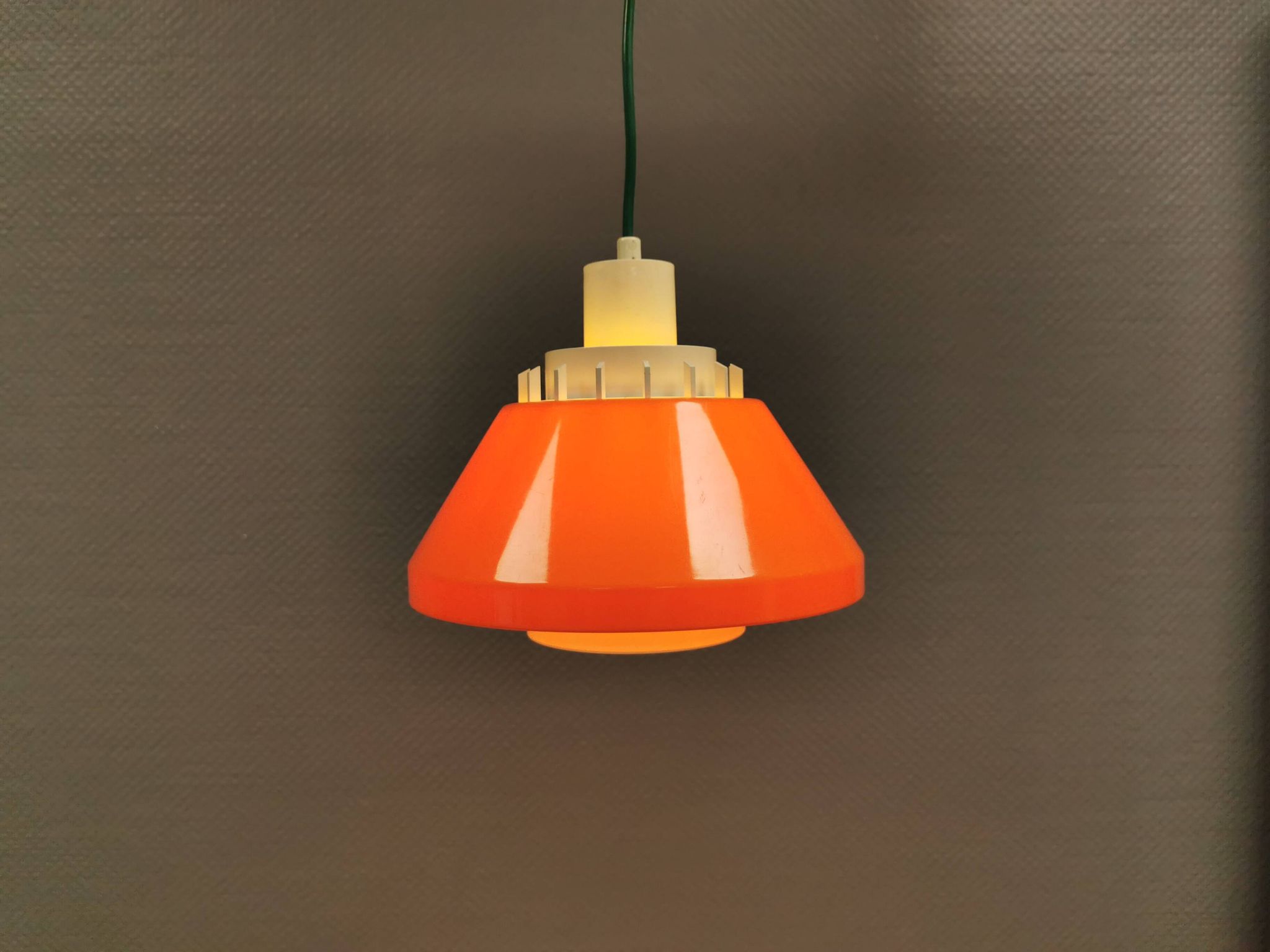 An orange pendant lamp made from hard-pressed ABS plastic. Denmark 1970s