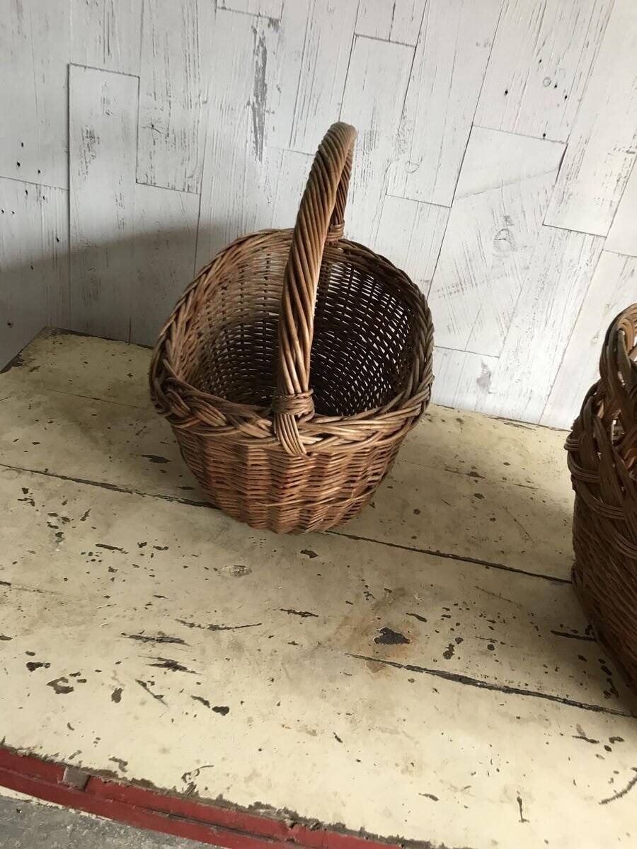 Set of 2 brown wicker baskets from the 1960s — decorative weaving and double handles.