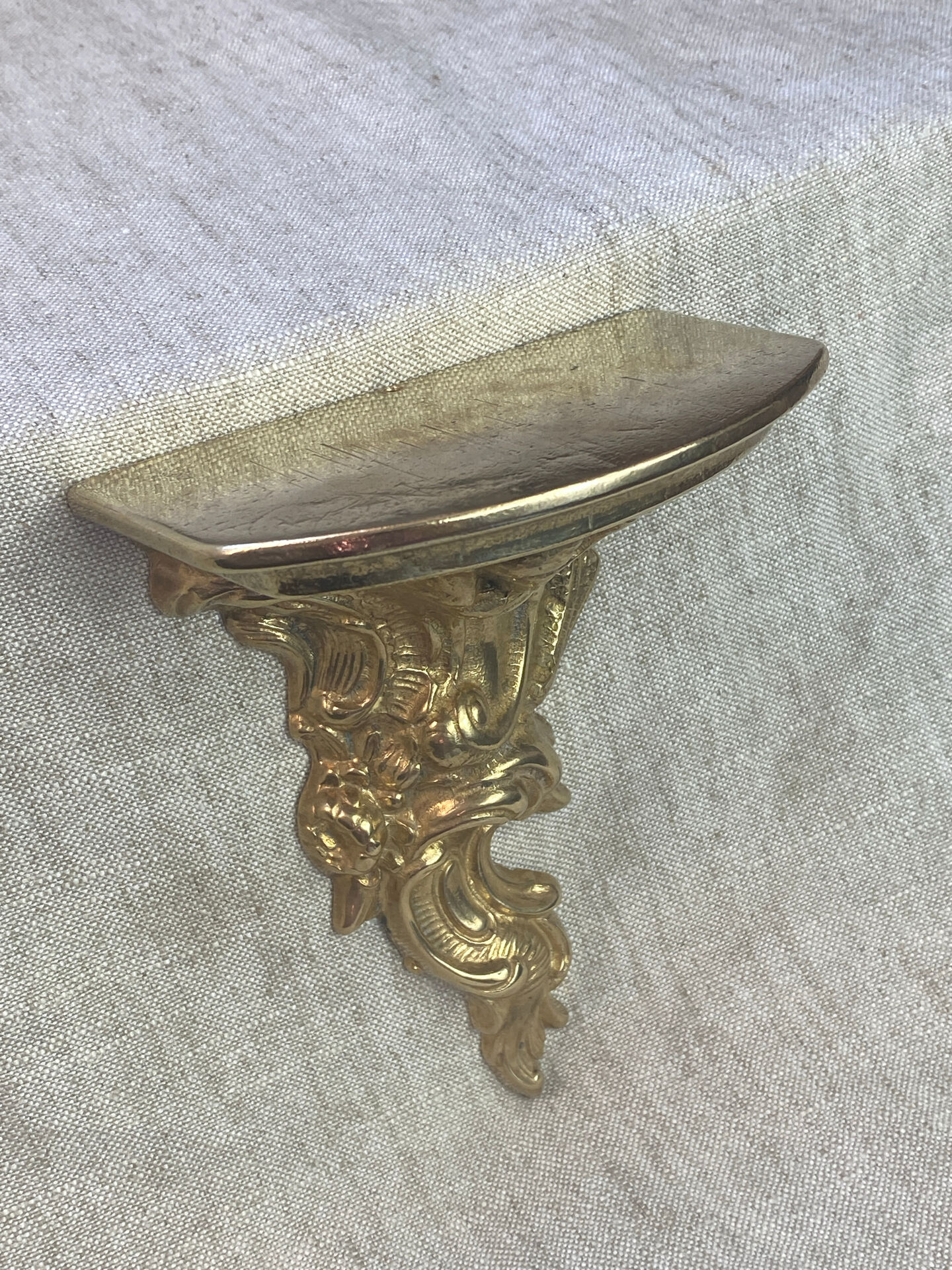 Small wall console in Rococo style in bronze