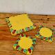 Yellow ceramic trivet and bottle coaster with vintage painted decoration.