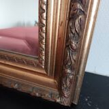 Miroir bois sculpté patine doré