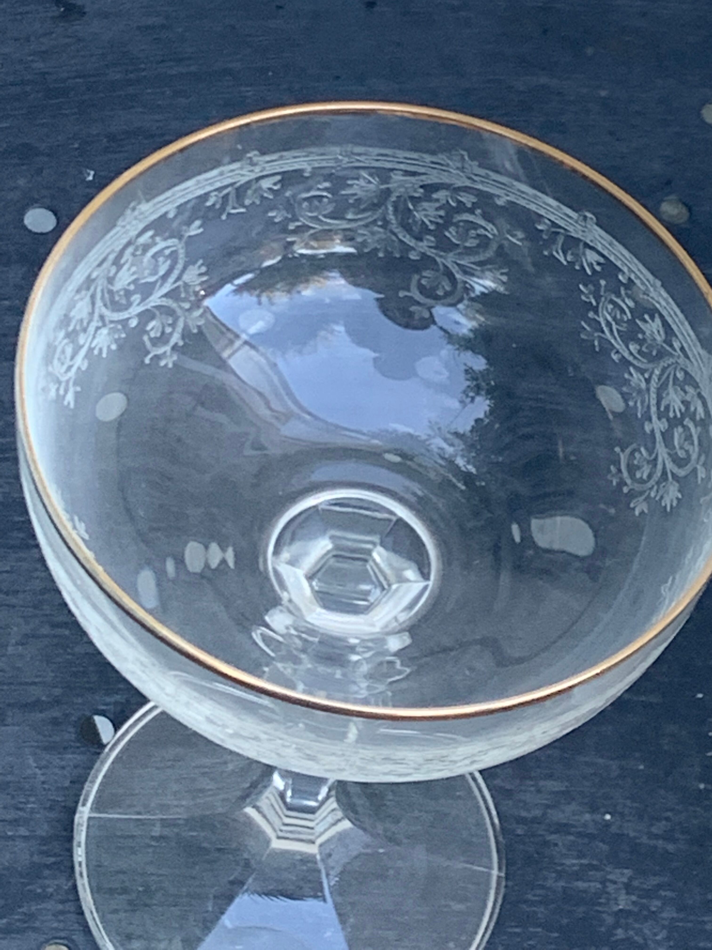 Two crystal champagne glasses and gilded borders antique engraved pattern