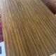 Vintage foldable bedside table in zebra wood – 1970s