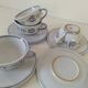Glazed earthenware cups and saucers