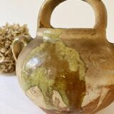 Small Provençal goat jug in creamy white and green enamelled stoneware