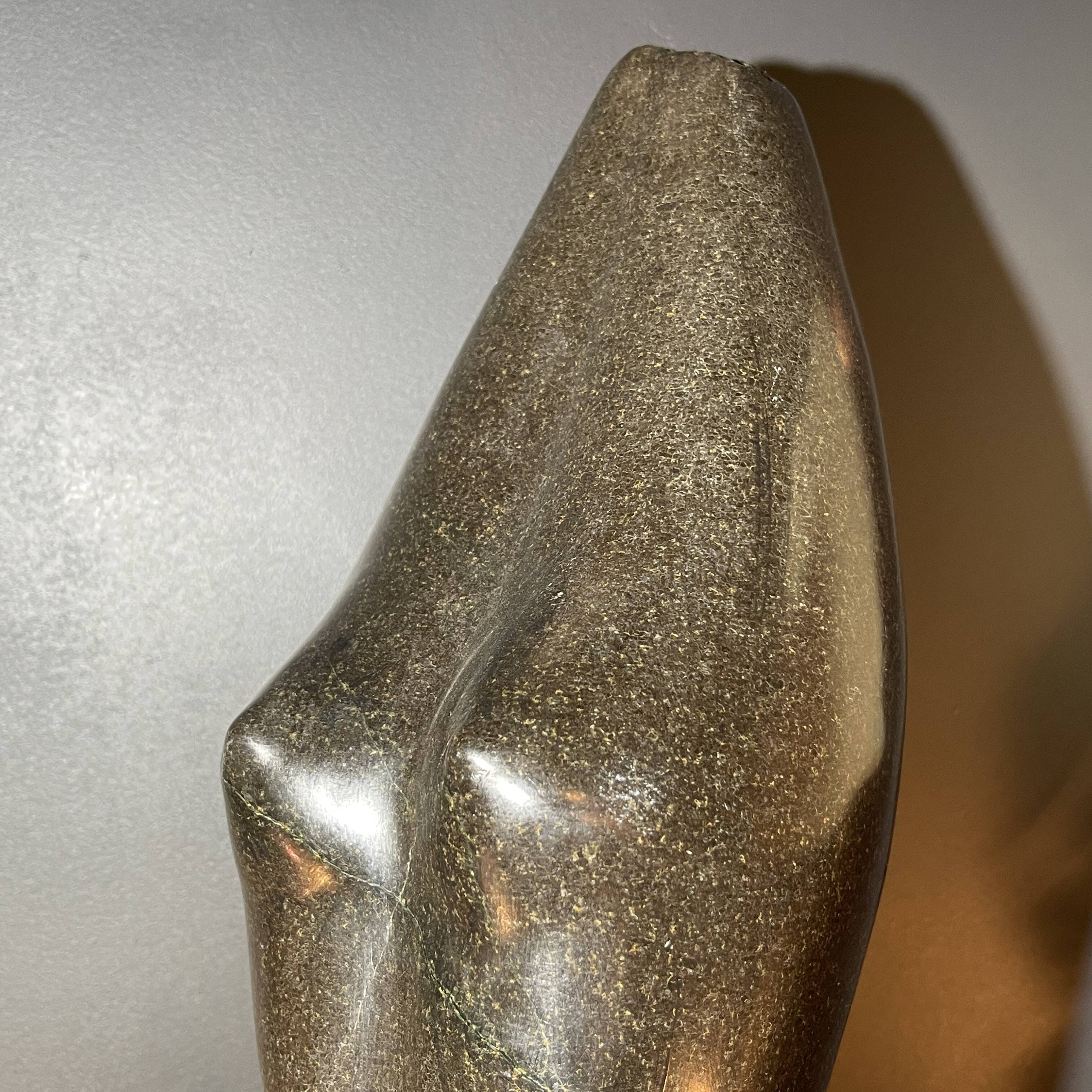 Abstract sculpture "naked woman" in stone (black marble), signed work, 20th century