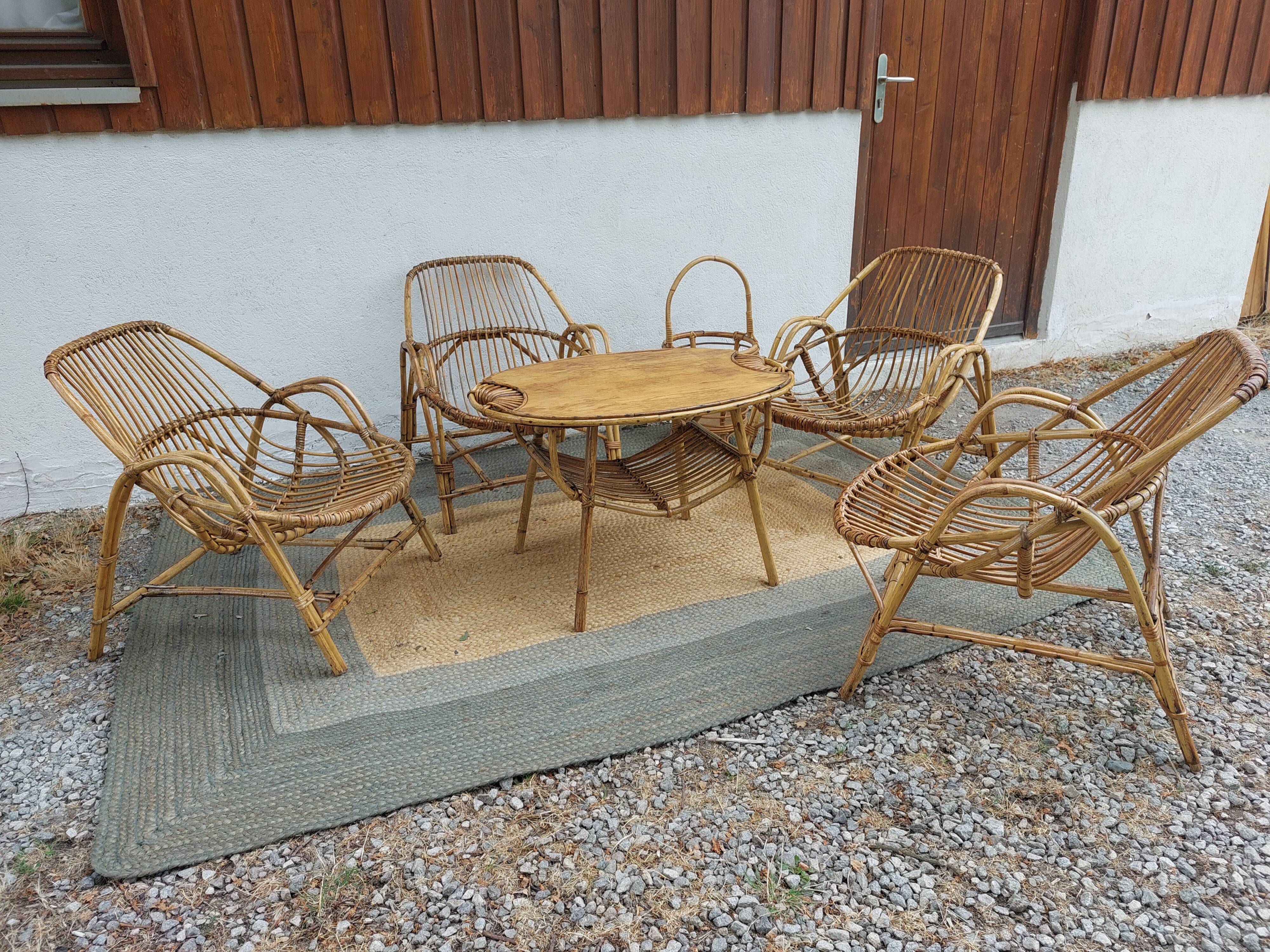 4 armchairs and a coffee table made of rattan and bamboo wood, vintage.
