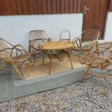 4 armchairs and a coffee table made of rattan and bamboo wood, vintage.