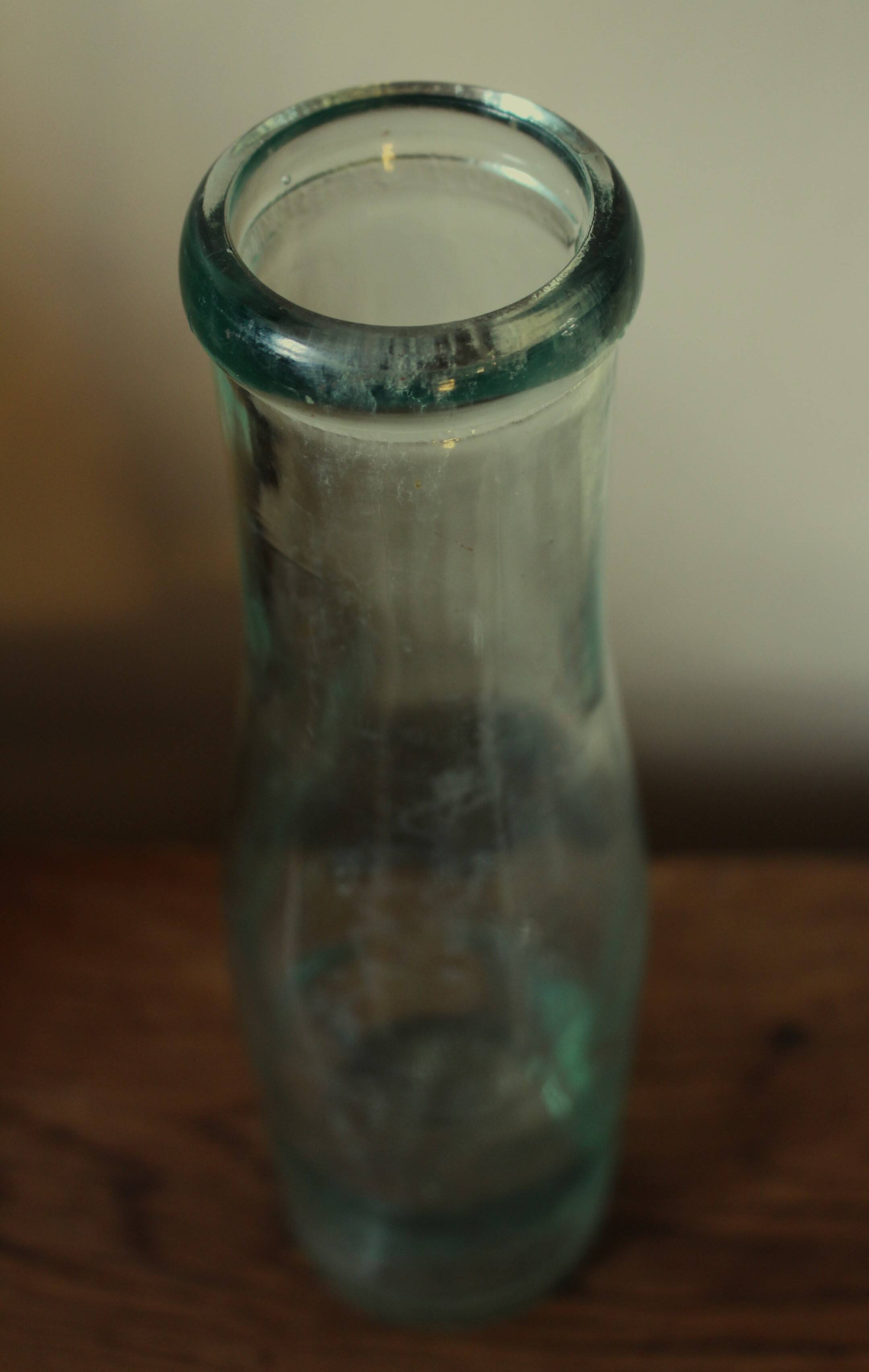 Antique glass milk bottle carafe