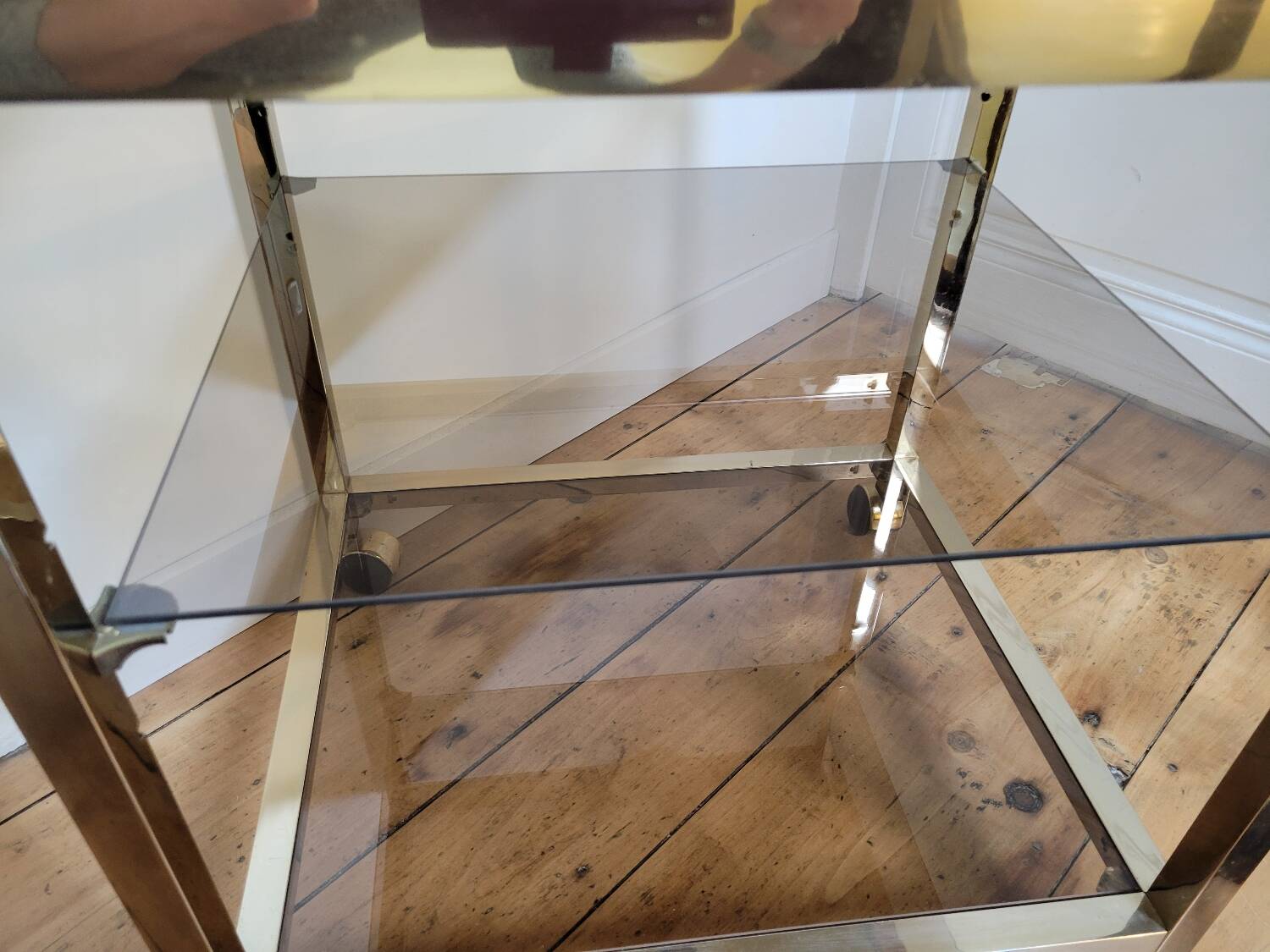 Gold metal and smoked glass serving trolley