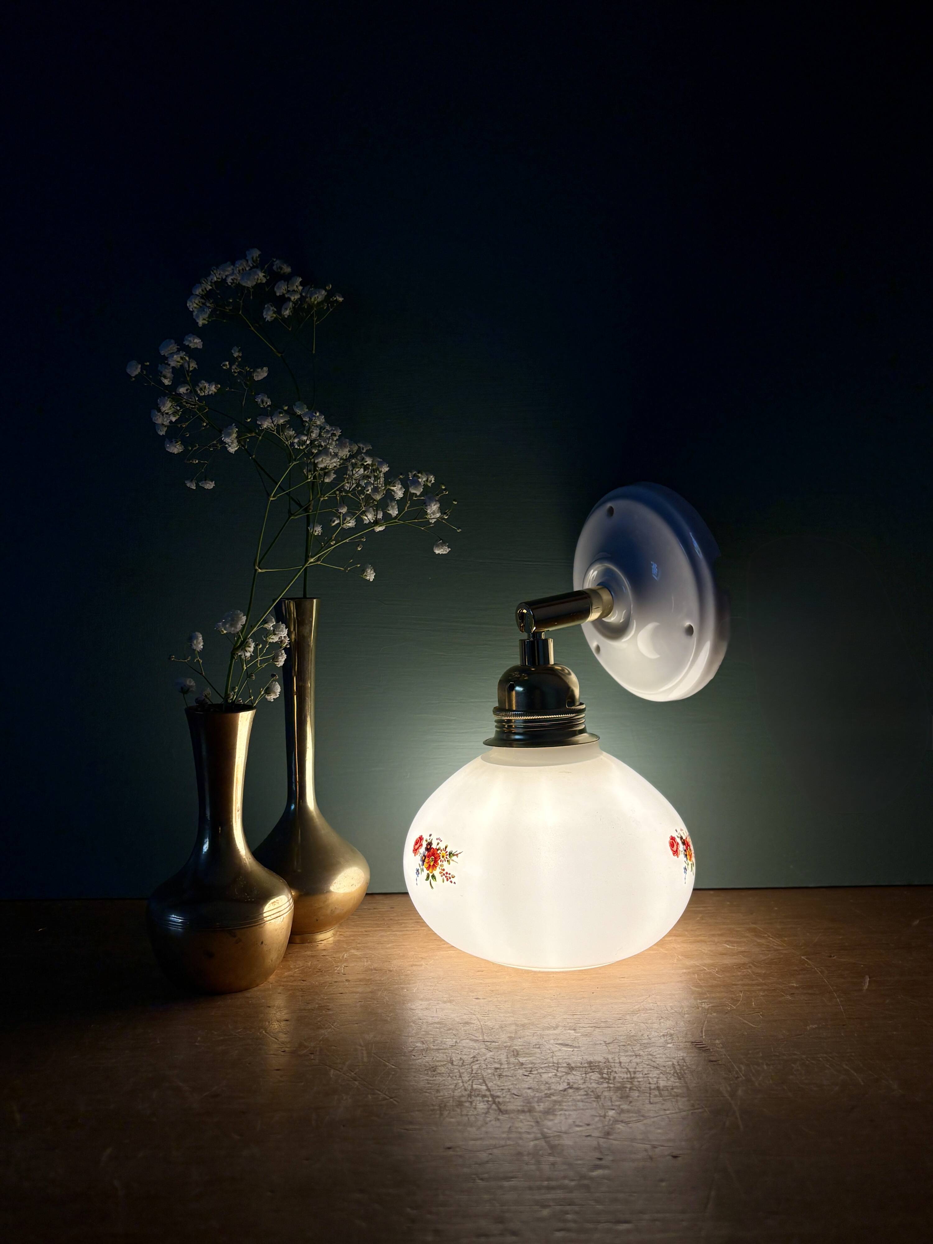 Vintage globe wall sconce in white opaline glass with floral decorations