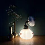 Vintage globe wall sconce in white opaline glass with floral decorations