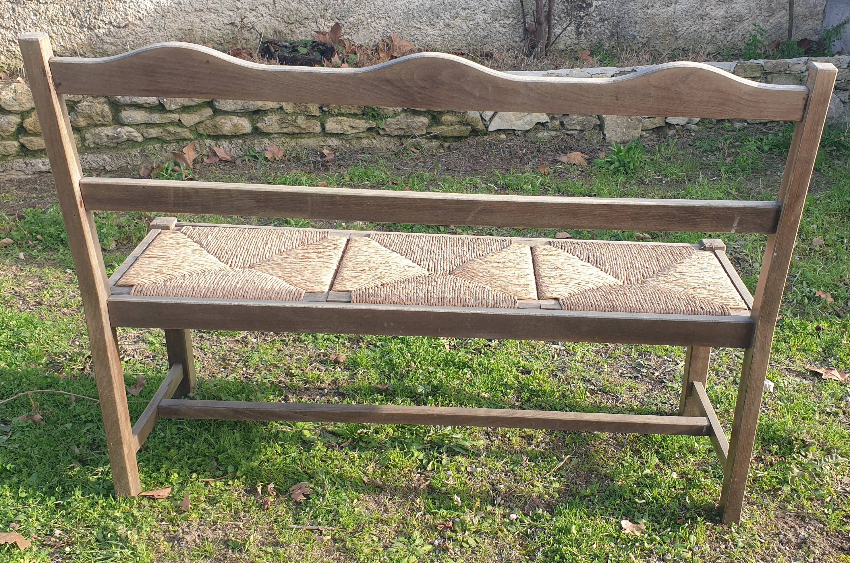 Wooden bench with vintage straw seating