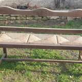 Wooden bench with vintage straw seating