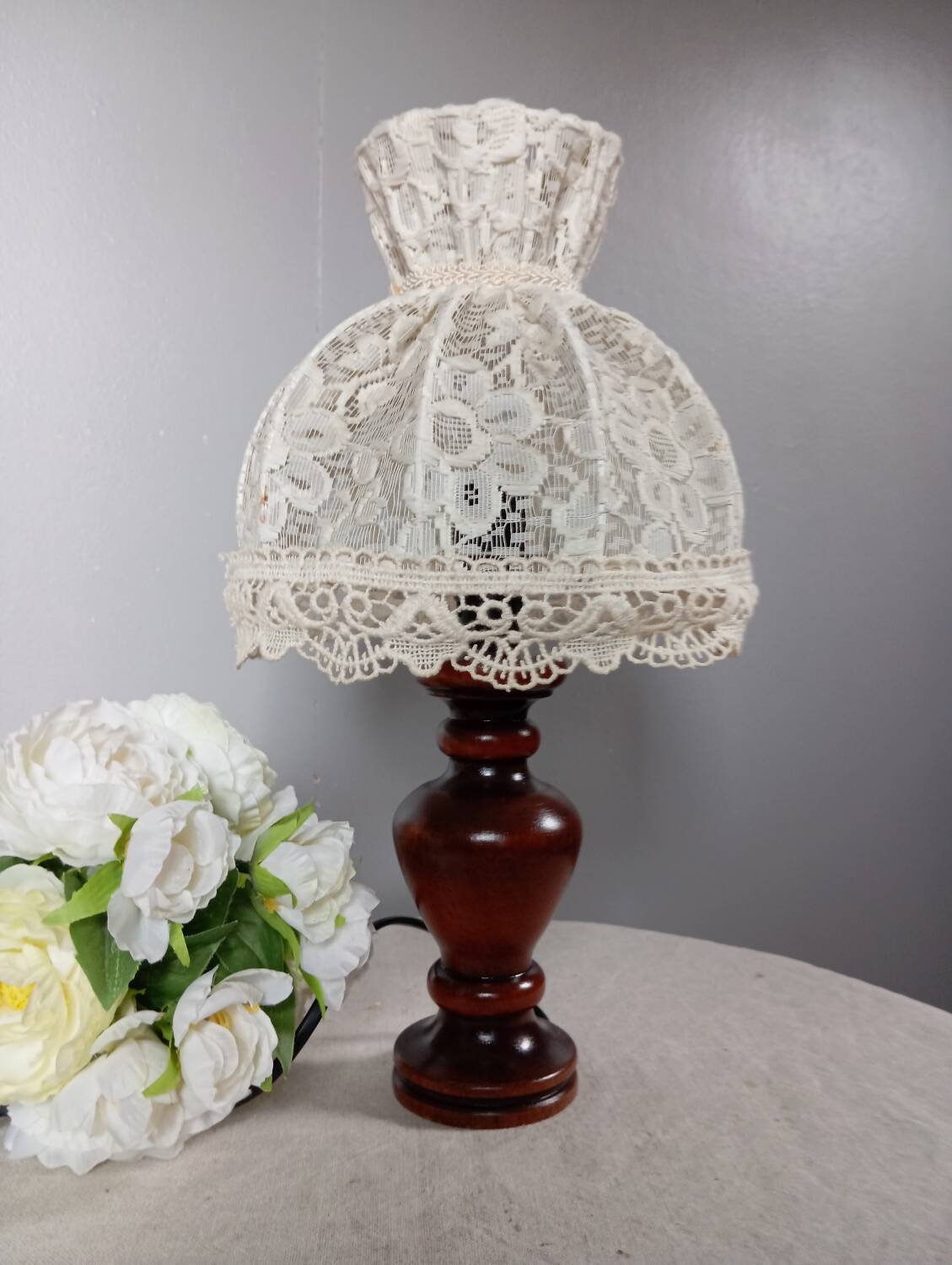 Table lamp with romantic wood and lace ambiance, retro chic