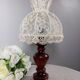 Table lamp with romantic wood and lace ambiance, retro chic