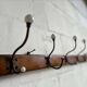 Vintage industrial wooden coat rack with porcelain hooks