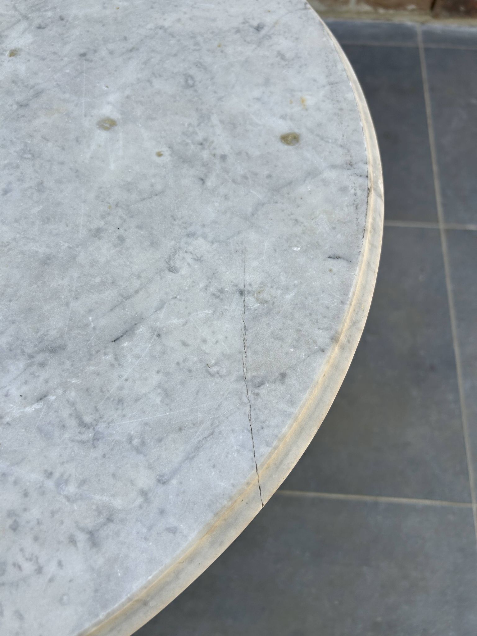 Art Nouveau cast iron and marble bistro table.