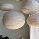 Average suspension in natural rattan and linen, Japanese-style, flattened oval in pink.