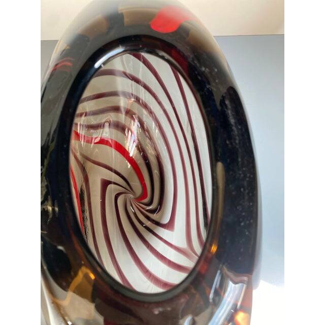 Abstract vase in smoked Murano glass and red reeds