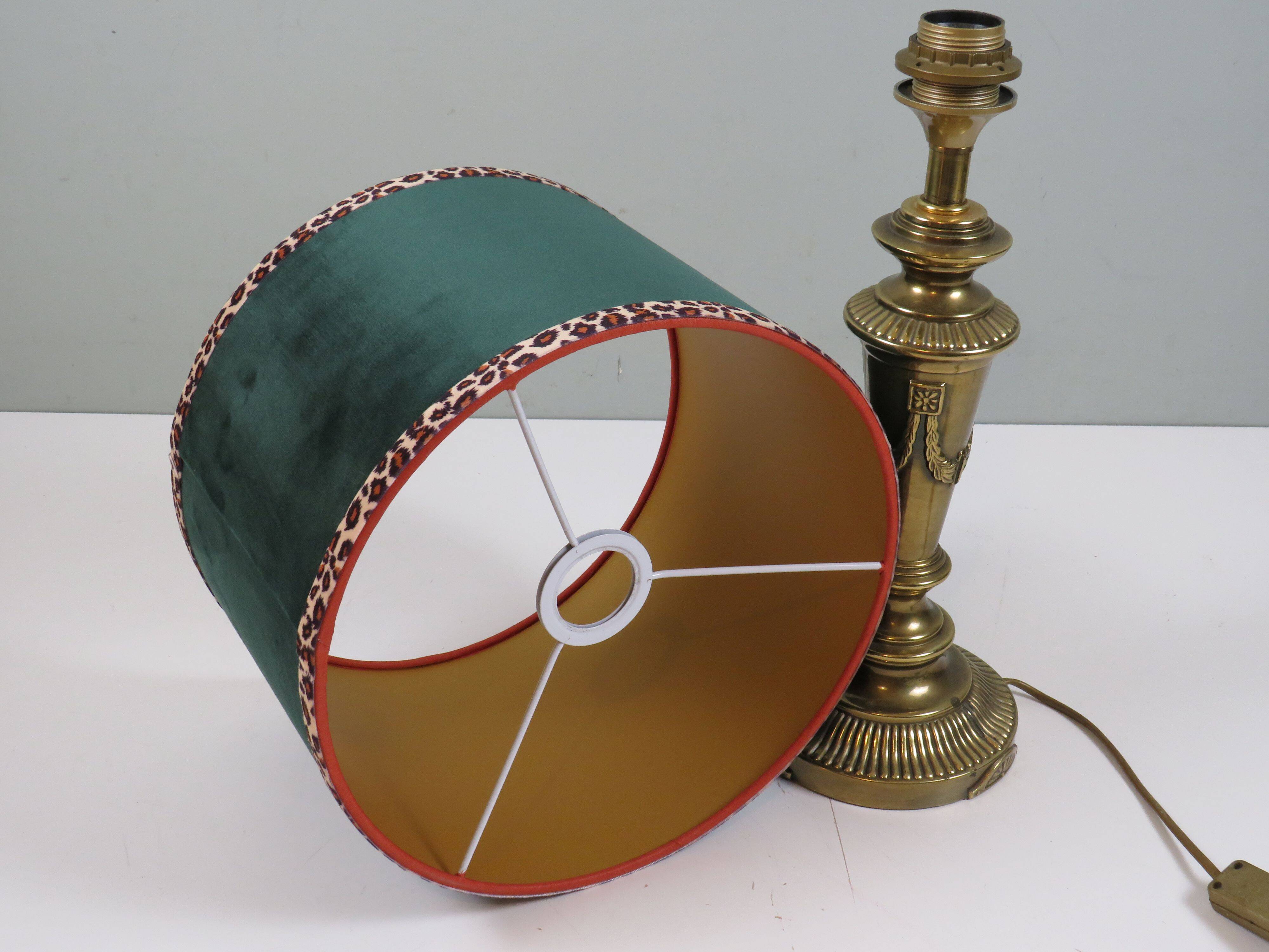 Vintage brass table lamp with green velvet shade.