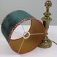Vintage brass table lamp with green velvet shade.