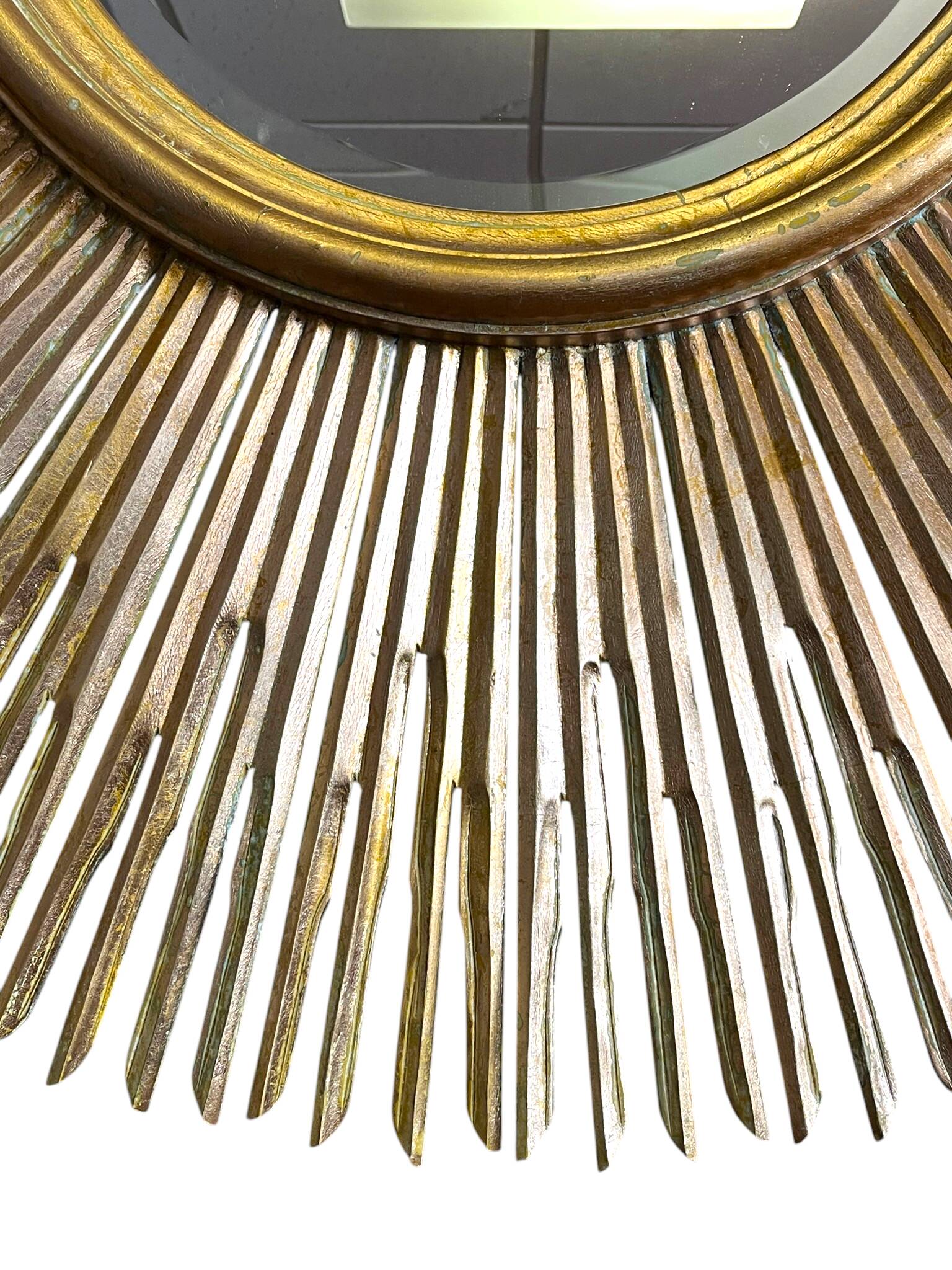 Large sunburst mirror with beveled glass and gilded wood from around 2010.
