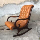 Rocking chair In studded orange leather Chesterfield