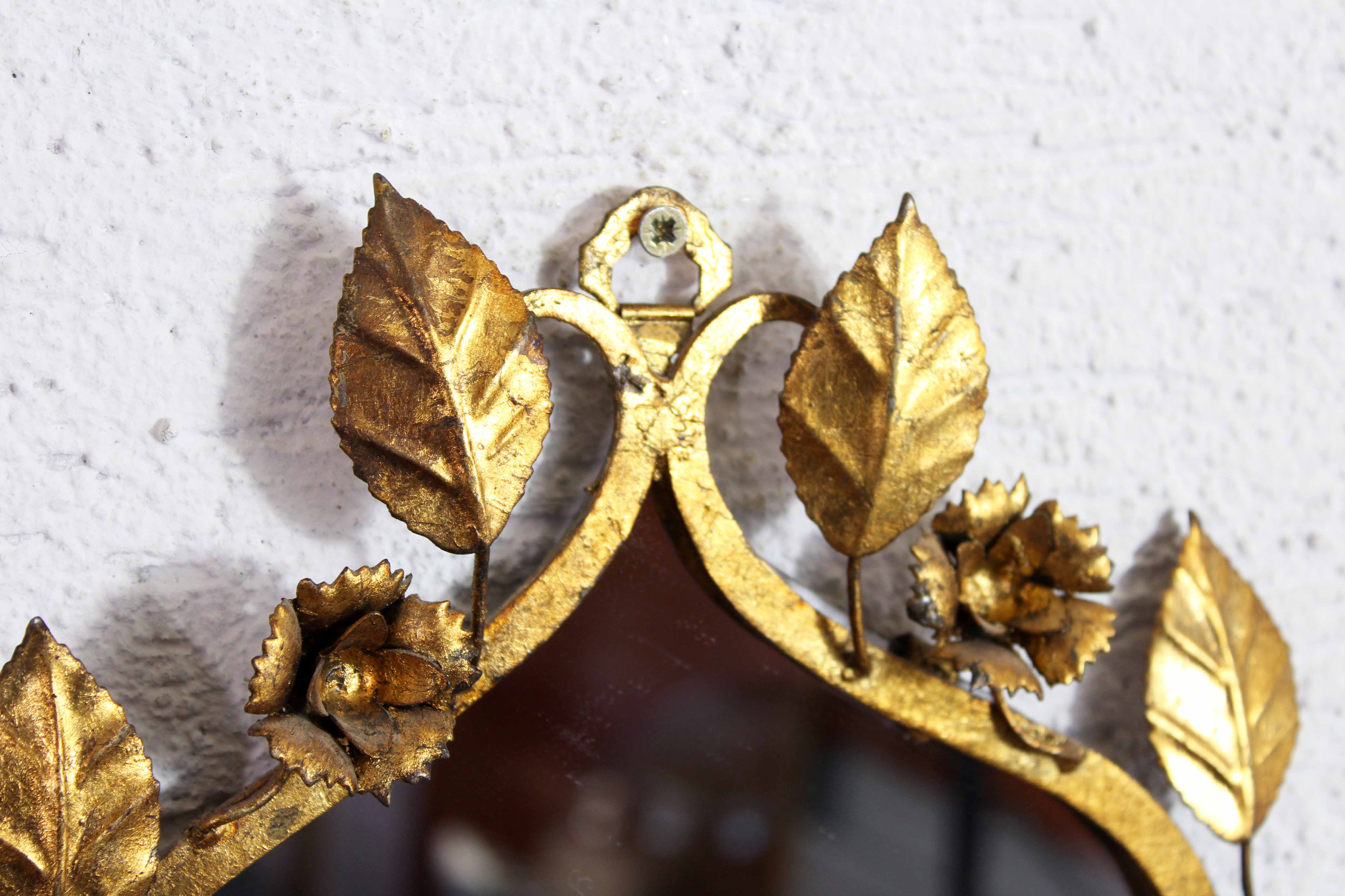 Old candlestick mirror gilded with leaf
