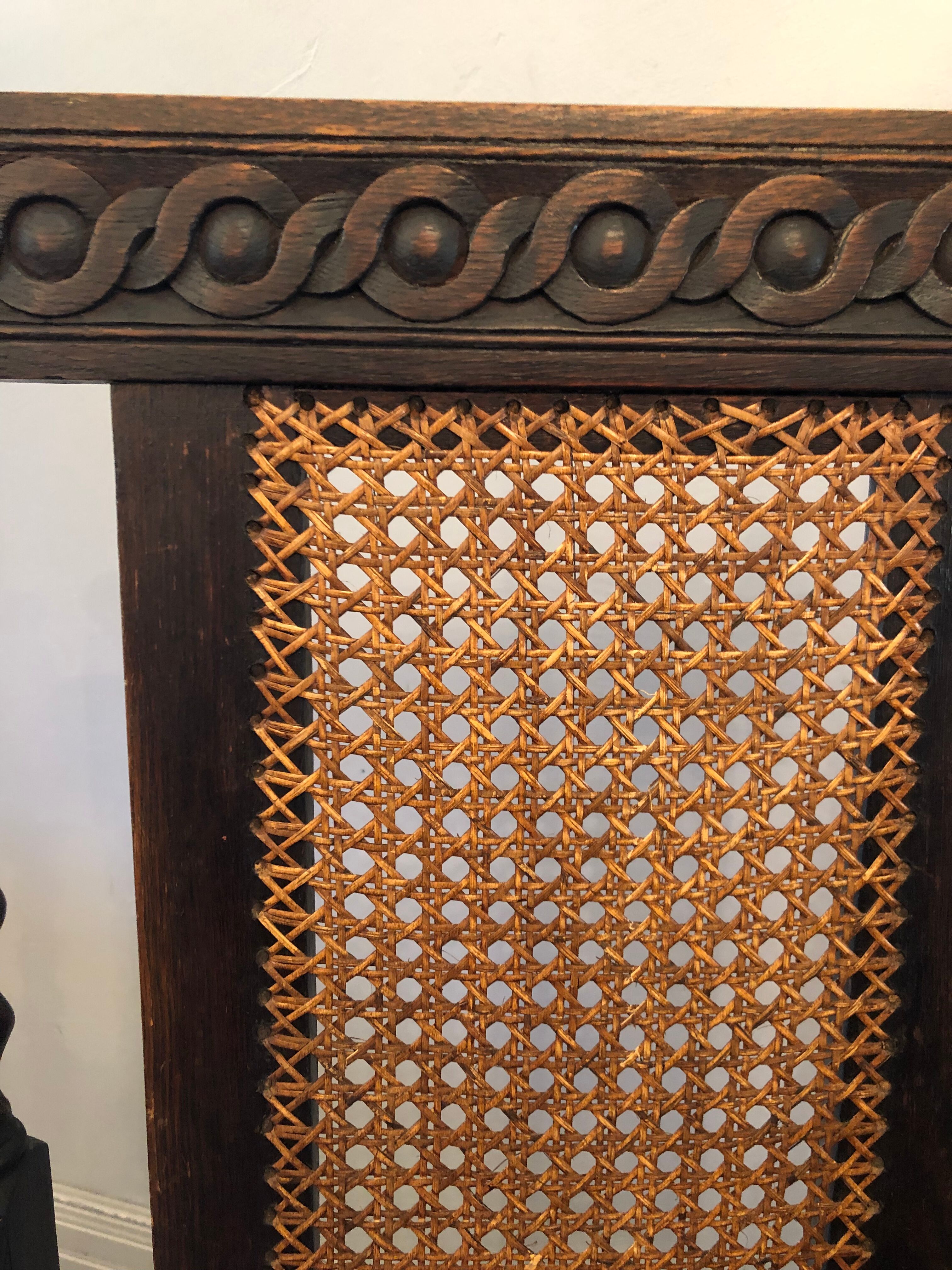 Carved wooden armchair and cannage