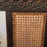 Carved wooden armchair and cannage