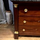 Empire chest of drawers with half columns in mahogany and gilded bronze