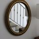 Oval gold mirror in Napoléon III style