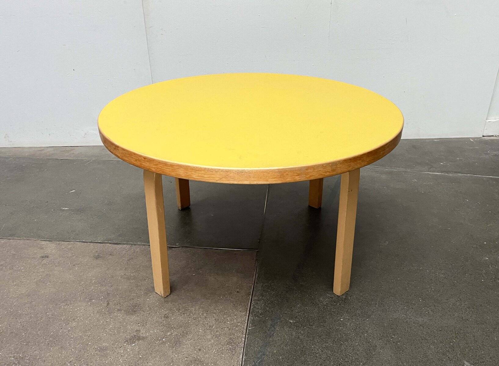 Mid-century modern yellow linoleum coffee table by Alva Aalto for Artek, Finland, 1960s.