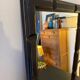 Patinated black rectangular wooden mirror