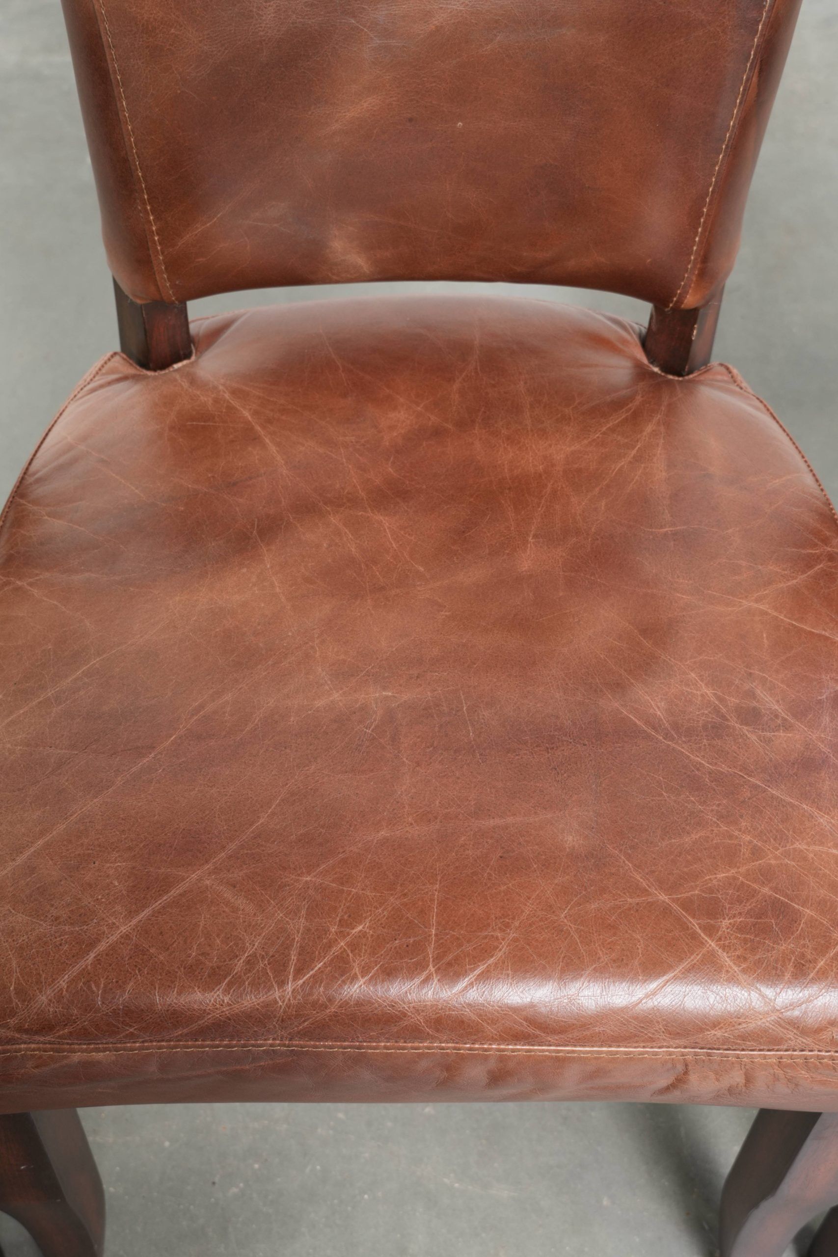 Set of 4 cognac-coloured cowleather dining chairs with decorative nails