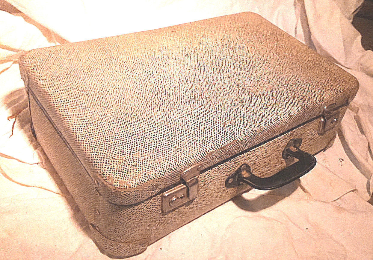 Old vintage black and white cardboard storage suitcase travel