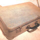 Old vintage black and white cardboard storage suitcase travel