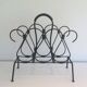 Magazine rack in leather and black lacquered metal. Attributed to Jacques Adnet